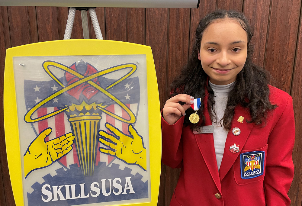 Four collision repair studentsGracey Crnjak (Avon Lake) smiles with her gold medal from the First Aid/CRP event. 