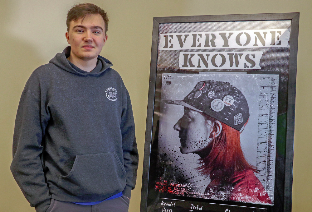 Calder Jessen (Columbia) proudly stands by his poster design, chosen to be on display at the Ohio Department of Education.