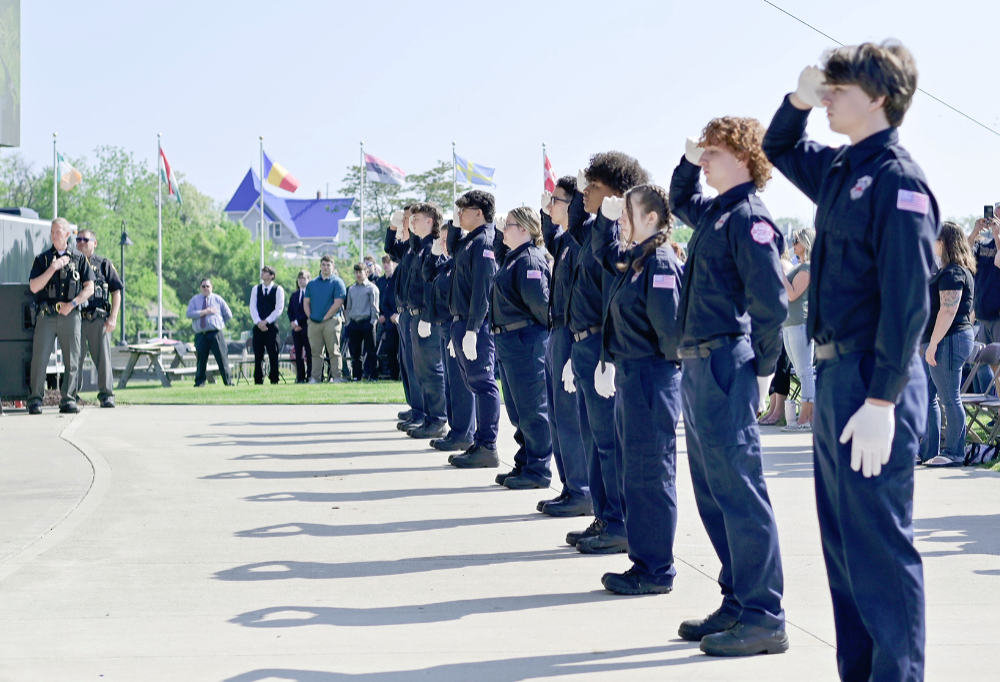 Lorain County JVS Public Safety seniors salute the American Flag during the singing of the National Anthem at the 2024 LCJVS Senior Recognition Ceremony.