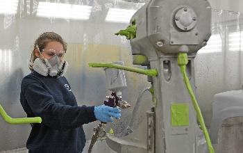 Paige Hale (Elyria) primes one of the mixers in the Collision Repair lab