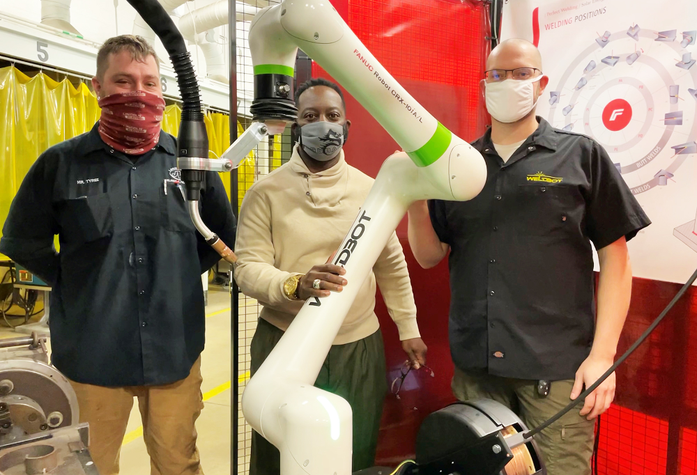 Tony Tyree, Lorain County JVS Welding and Fabrication instructor; Dr. Glenn Faircloth, Lorain County JVS superintendent; Levi Bowman, Weldbot president stand next to the new FANUC CRX Cobot.