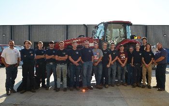 JVS Industrial Equipment Mechanics juniors , Tom Stanard and Mason Bremke stand in front of tractor
