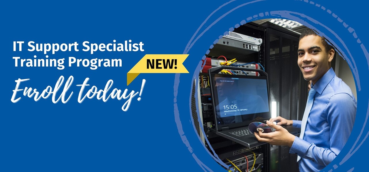 Male IT Specialist smiles at camera at computer. IT Support Specialist Training Program. New! Enroll Today!